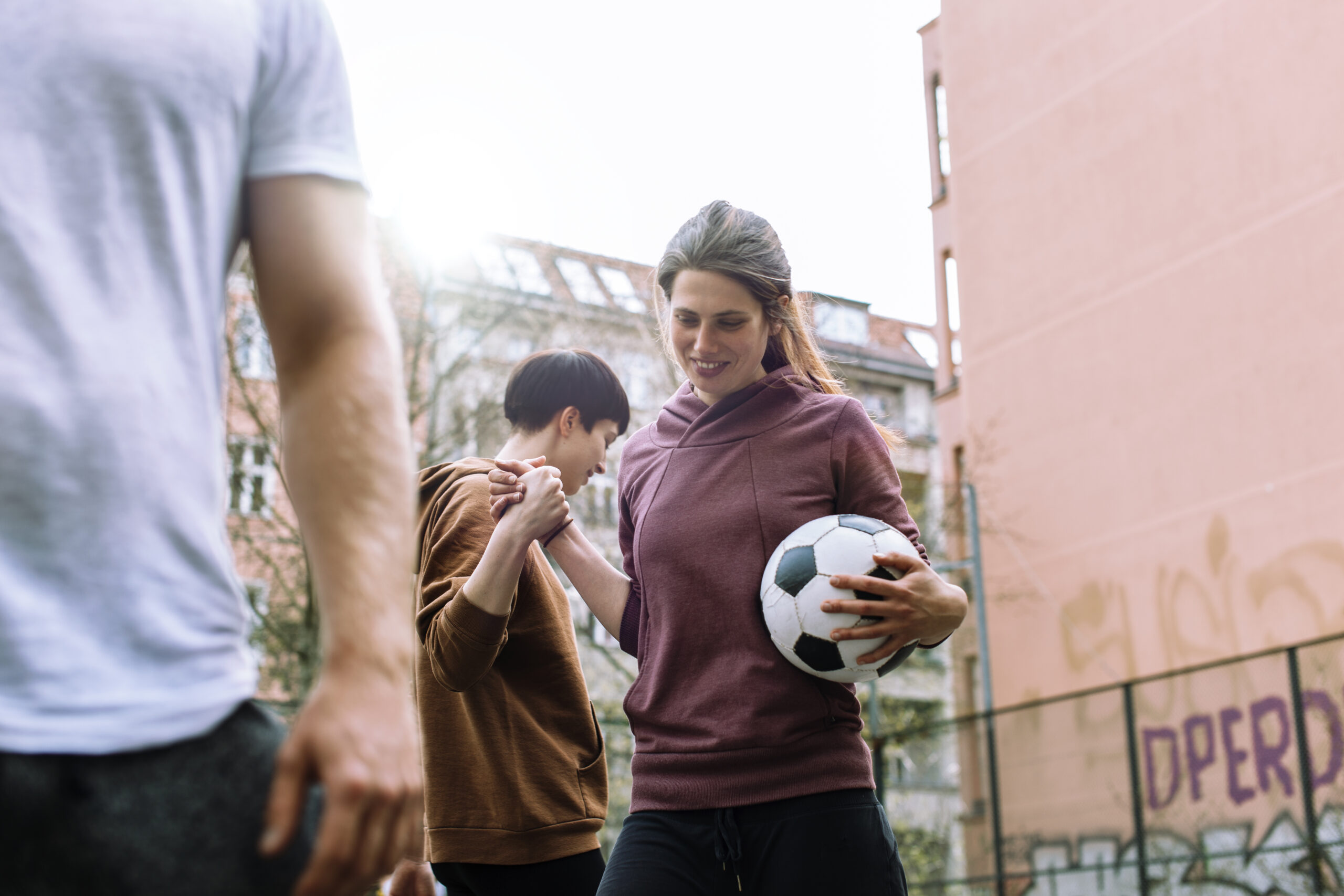 Woman Playing Urban Soccer
